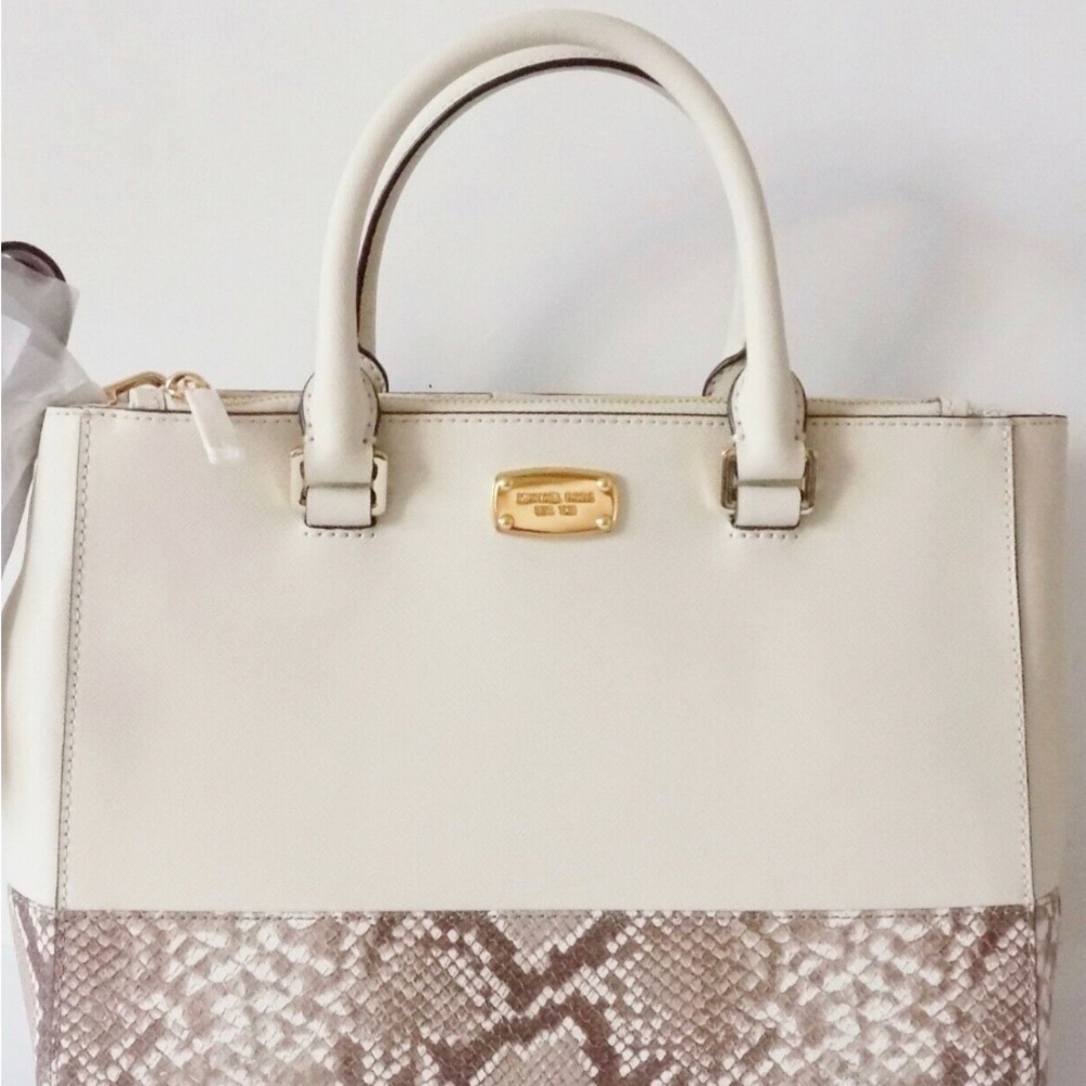 Michael Kors beige and snake print purse with matching wallet.